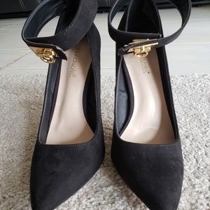 Black 5 inch heels with ankle wrap.